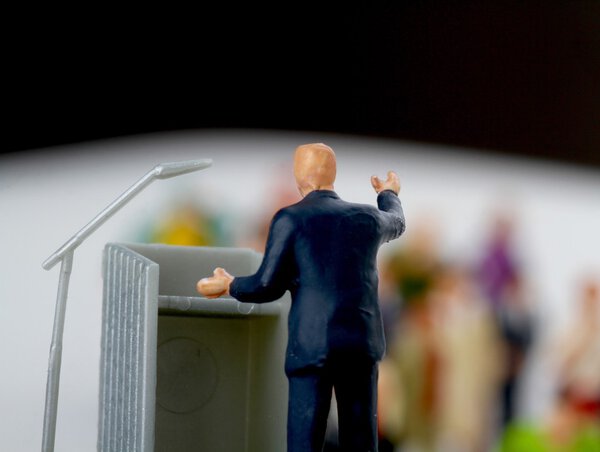 miniature figurine of a politician speaking to the crowd during an election