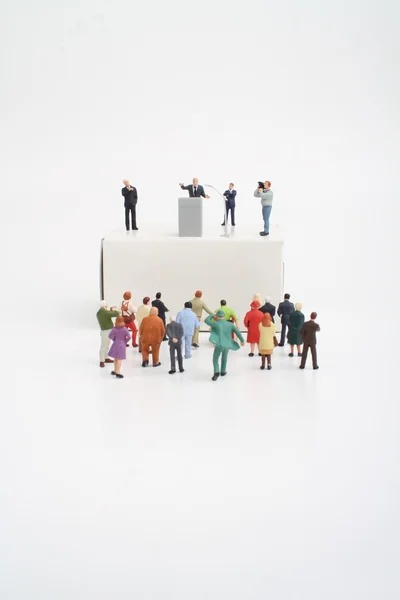 Miniature figurine of a politician speaking to the crowd during an election — Stock Photo, Image