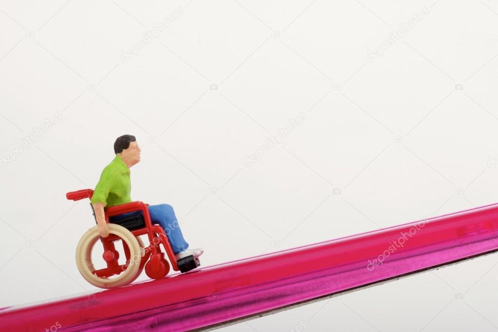 Miniature of a disabled man on a wheelchair