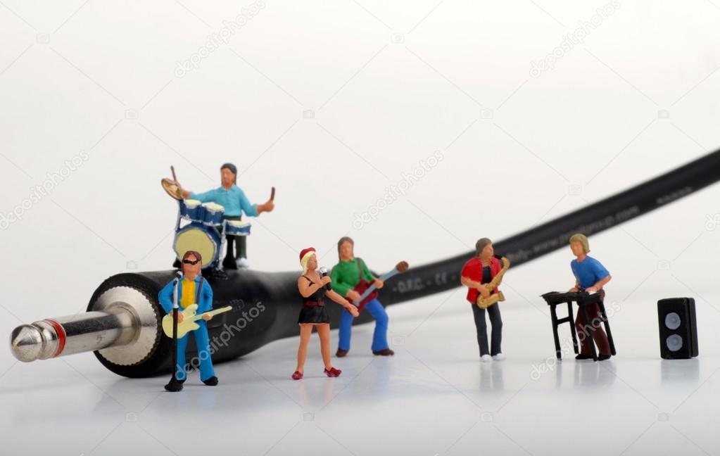 Miniature of a rock band performing