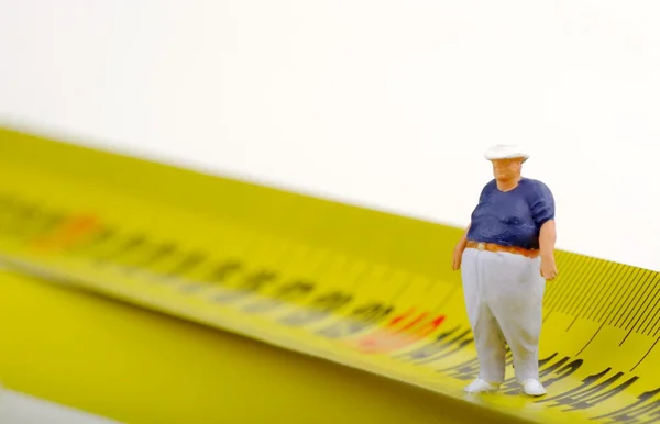 Tlustý muž na měření - miniaturní — Stock fotografie