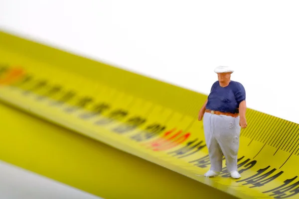 Gros homme sur un mesureur - miniature — Photo