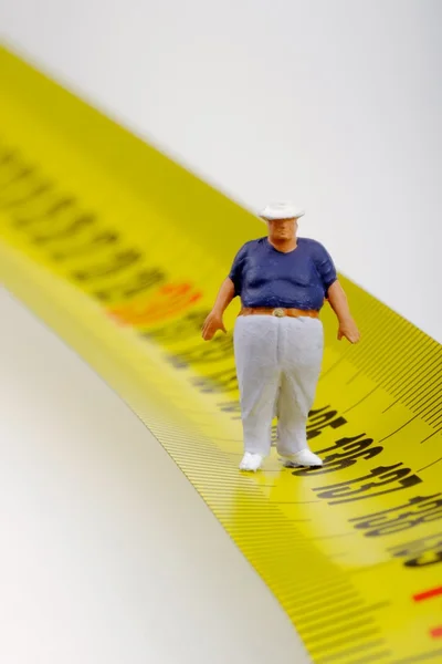 Толстяк на измерителе - миниатюра — стоковое фото