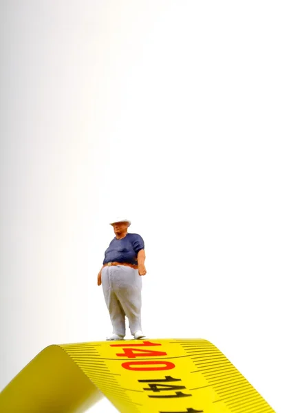 Tlustý muž na měření - miniaturní — Stock fotografie