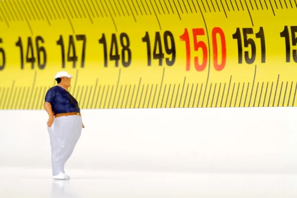 Homem gordo em um medidor - miniatura — Fotografia de Stock