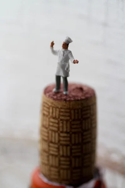 Chef miniature on the cork of a wine bottle — Stock Photo, Image