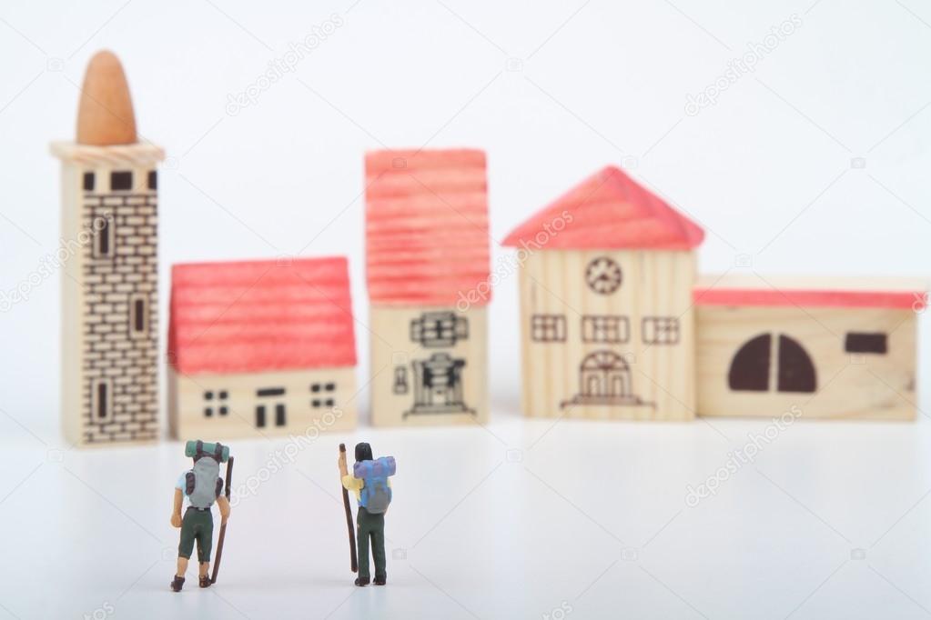 hiker miniatures reaching a village or a shelter