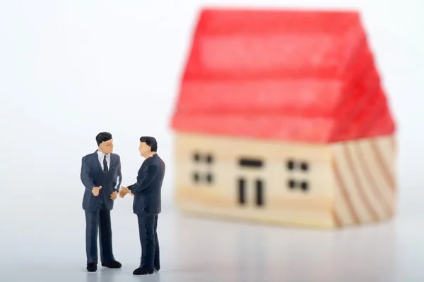 Miniature concept of real estate negotiation — Stock Photo, Image