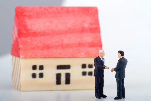 Miniature concept of real estate negotiation — Stock Photo, Image