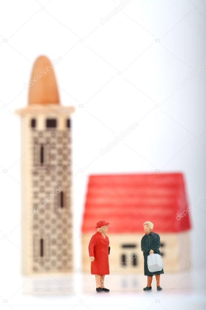 miniatures of women gossiping outside the church