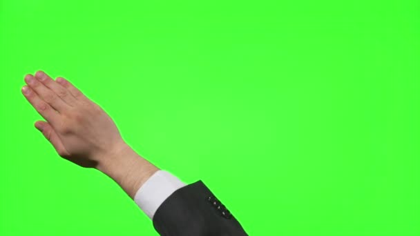 緑色の画面上の仮想のビジネス環境で手ジェスチャーを作る青年実業家 — ストック動画