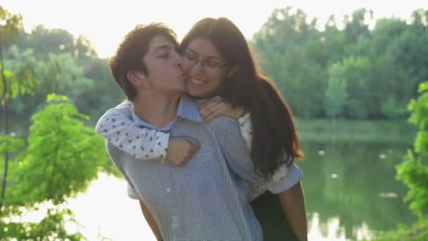 Happy loving couple having fun at sunset — Stock Video