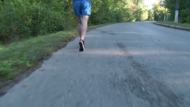 Young man jogging at sunrise — Stock Video