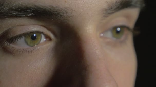 Close-up of a young man eyes opening and blinking — Stock Video