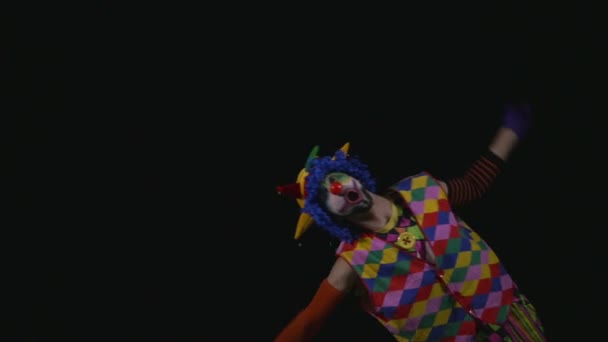 Young funny clown swimming in an invisible water — Stock Video