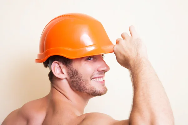 Attractive young man in a helmet — Stock Photo, Image