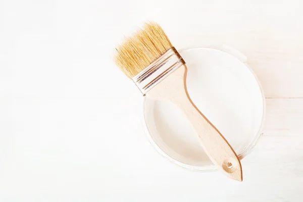 Bank paints and brush on a wooden background — Stock Photo, Image