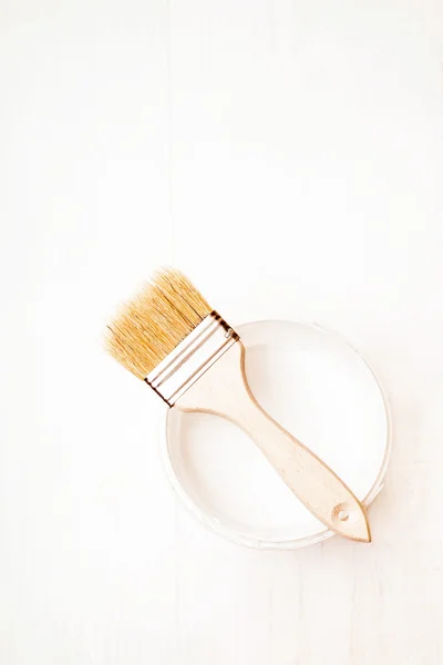 Bank paints and brush on a wooden background — Stock Photo, Image