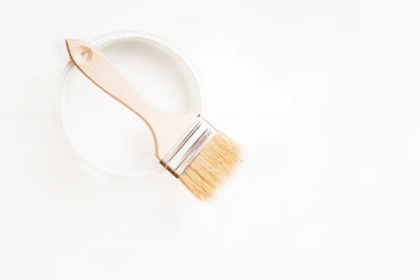The container of paint and a brush — Stock Photo, Image