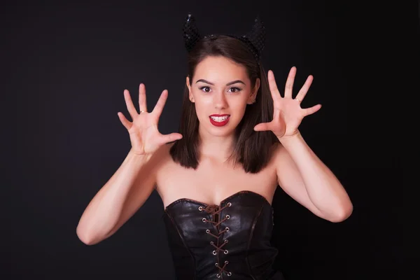 Young cheerful woman with and horns on her head — Stock Photo, Image