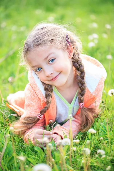 Cute little girl on the meadow in summer day — Stock Photo, Image