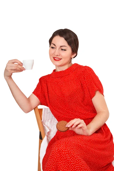 Mujer sosteniendo una taza de café y galletas —  Fotos de Stock