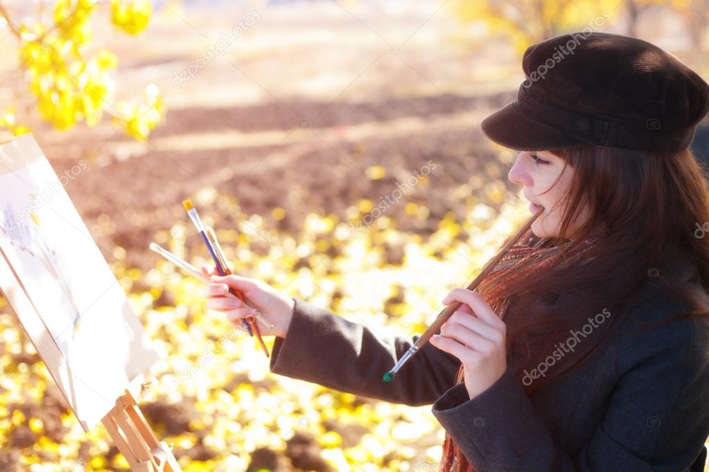 The girl is engaged in painting