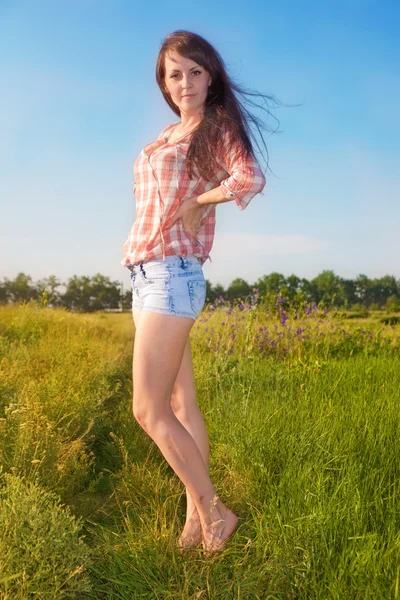 Beautiful slim girl on background of the nature Royalty Free Stock Photos