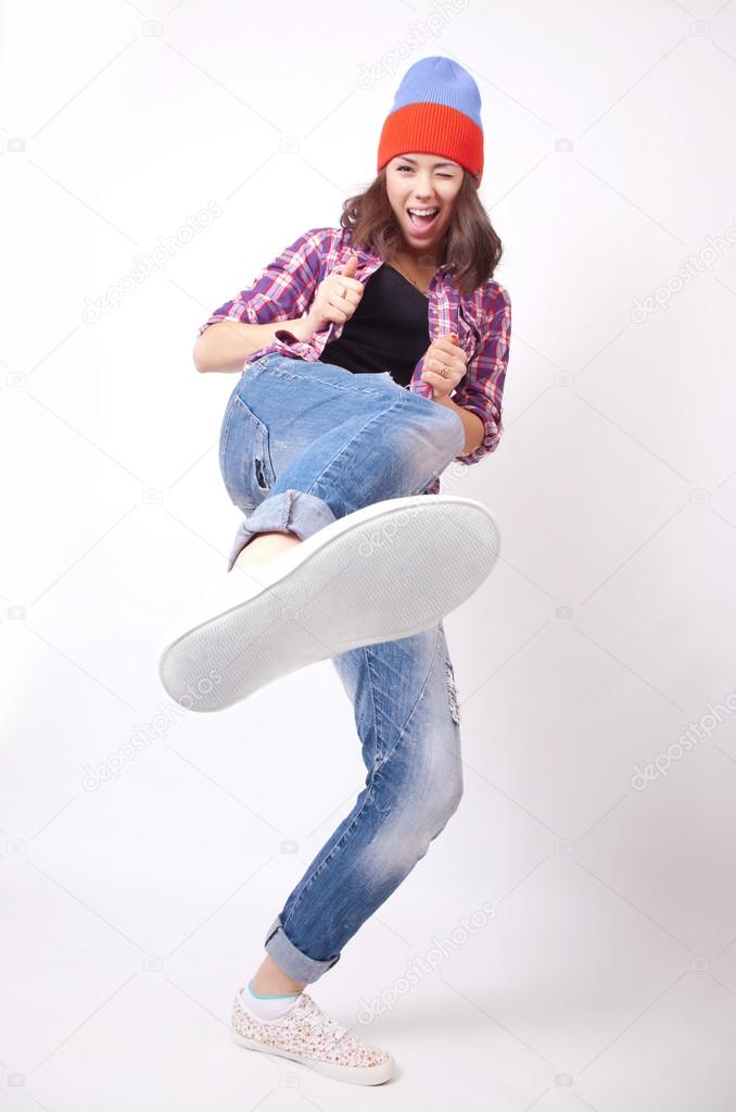 Teenage girl in torn jeans