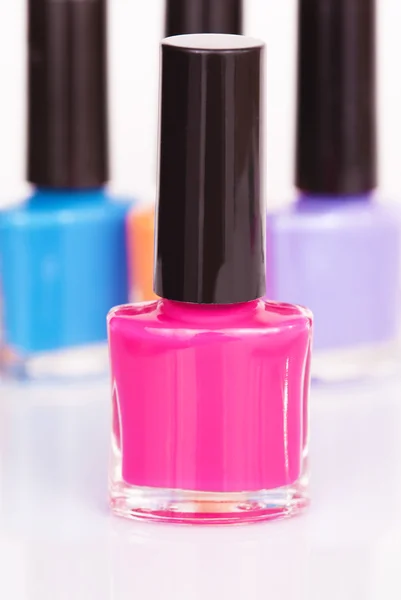 Tre multi-färgade nagellack — Stockfoto