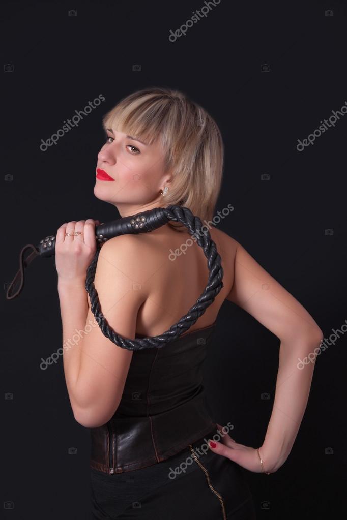 Woman With A Whip In Her Hand Stock Photo, Picture and Royalty Free Image.  Image 31209513.