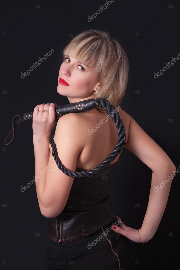 Woman with a whip in her hand Stock Photo by ©MyraLypa 67949437