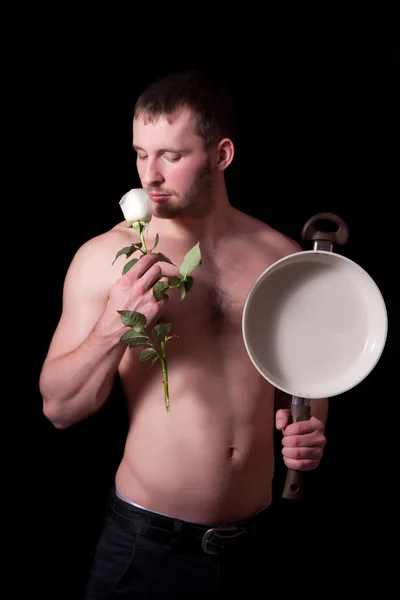 Homme avec poêle et fleur — Photo