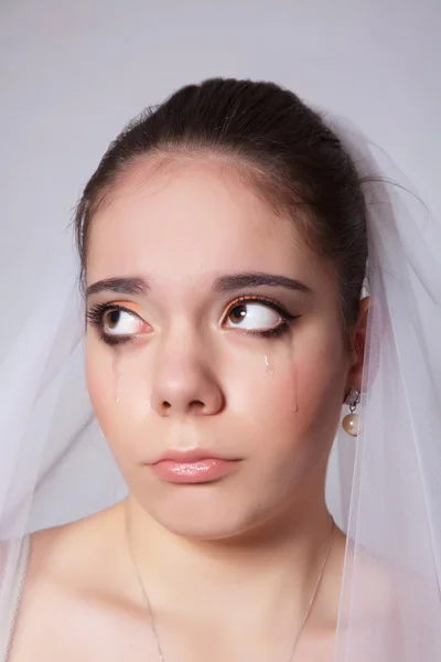 Portrait of a beautiful bride crying, closeup