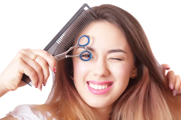 Close-up portrait of a hairdresser with scissors and comb — Stock Photo, Image