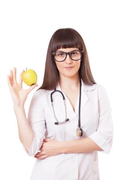 Mujer en una bata de laboratorio blanca con manzana —  Fotos de Stock