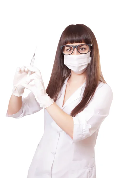 Beautiful young doctor in medical robe holding syringe — Stock Photo, Image
