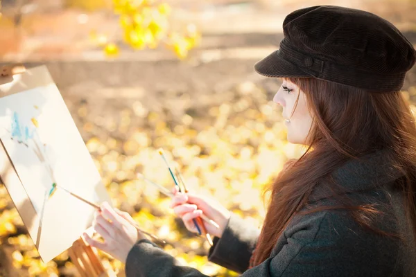 Portrait of the young beautiful woman with brush — Stock Photo, Image