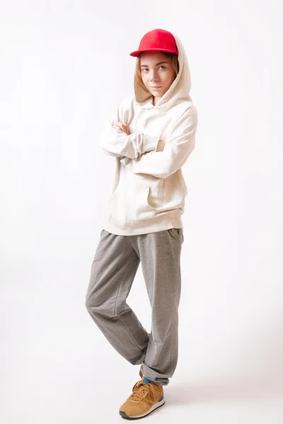 Teenager in a red cap and sportswear — Stock Photo, Image