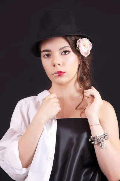 Portrait of the woman with a theatrical makeup on black background — Stock Photo, Image