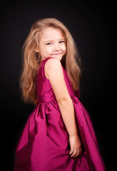 Niña linda en un vestido rosa — Foto de Stock