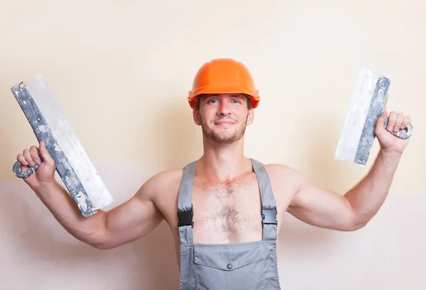 Man with two spatulas in hand — Stock Photo, Image