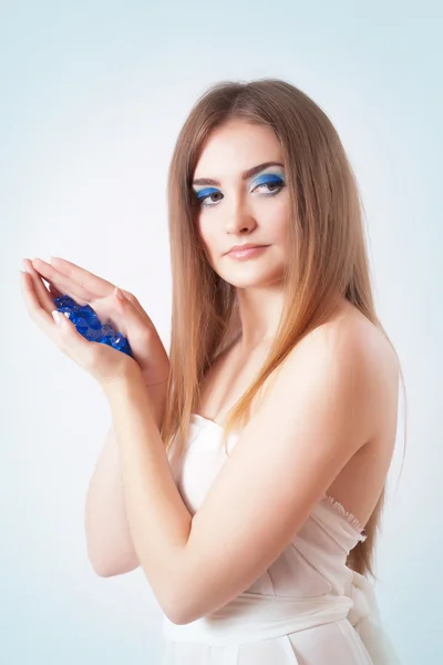 Portrait of a beautiful young woman with bright blue make up — Stock Photo, Image