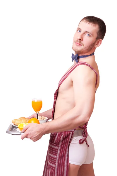 Rolig människa i ett förkläde med frukost — Stockfoto