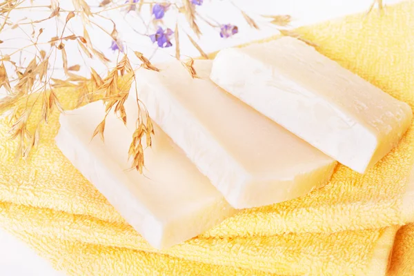 Homemade soap on a yellow towel — Stock Photo, Image