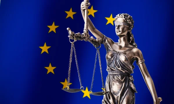 Themis with scale, symbol of justice on European Union flag back — Stock Photo, Image