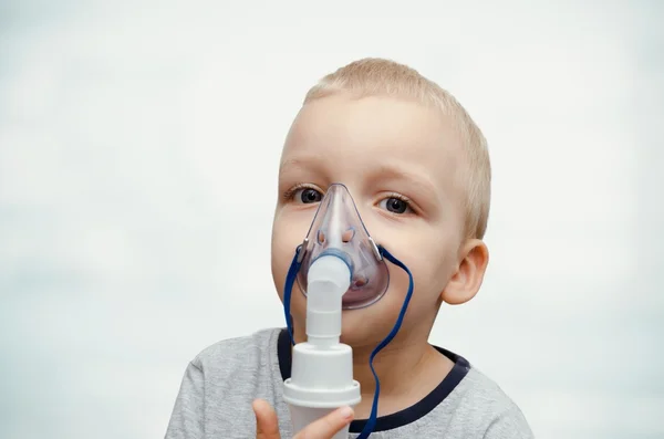 Child making inhalation with mask on his face. — Stock Photo, Image