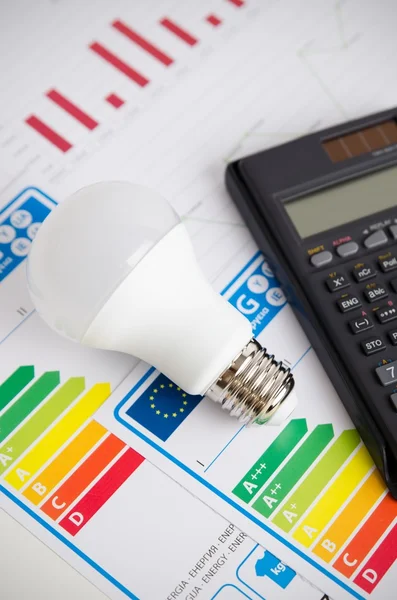 LED light bulb on energy efficiency chart. — Stock Photo, Image