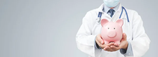 Doctor Holding Piggy Bank Health Costs Health Insurance Concept — Stock Photo, Image