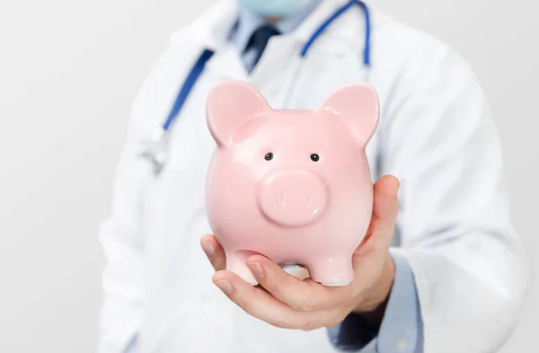 Doctor Holding Piggy Bank Health Costs Health Insurance Concept — Stock Photo, Image